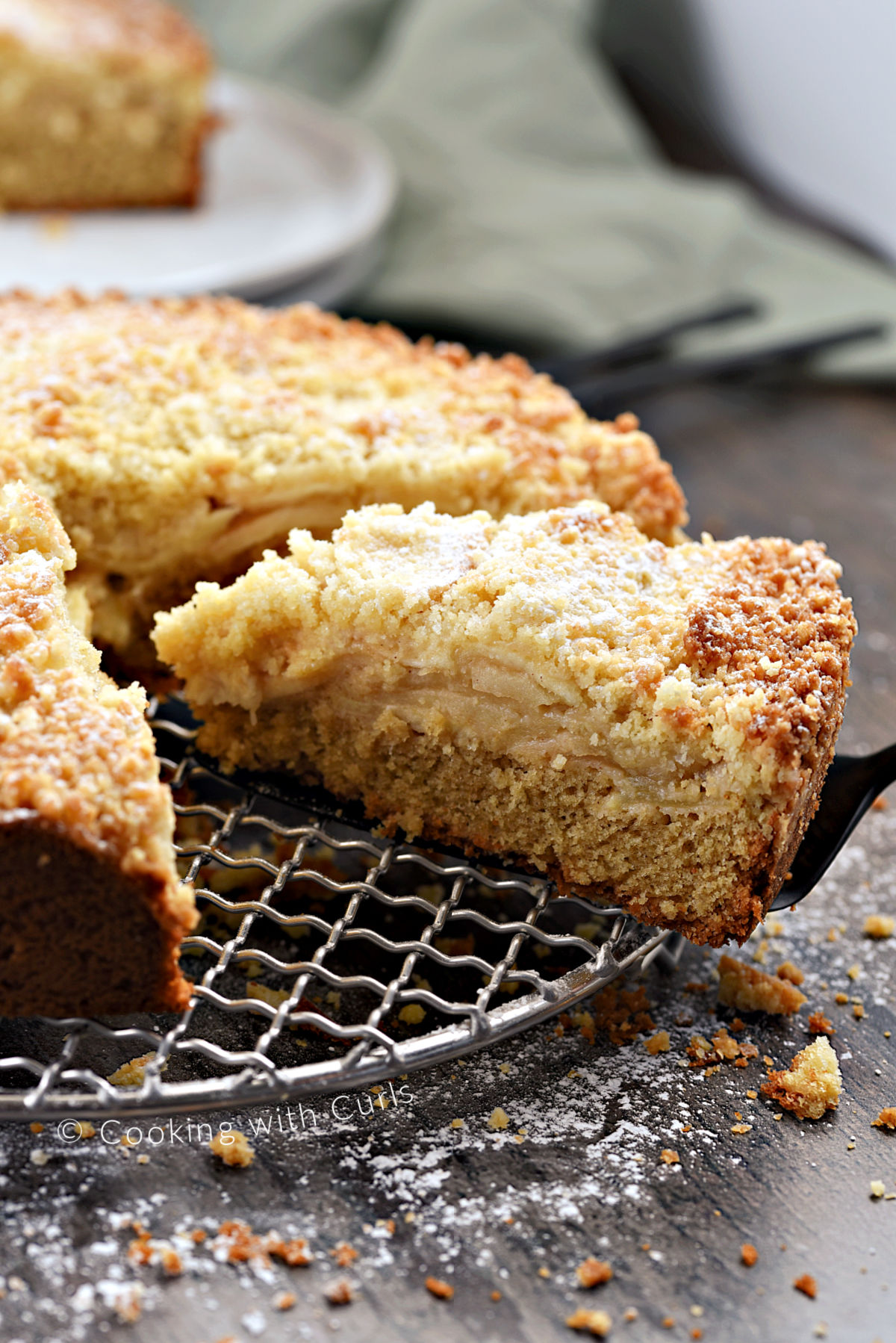 A slice of Irish Apple Cake on a serving spatula. 