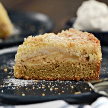 A slice of Irish Apple Cake on a blue plate.