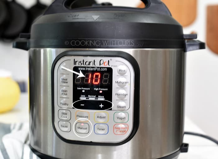 An Instant Pot with the Manual button selected and 10 minutes showing on the display 