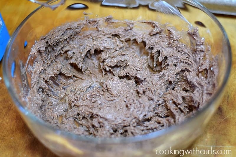 Chocolate Peanut Butter, sugar, and egg beaten in a large, glass bowl.