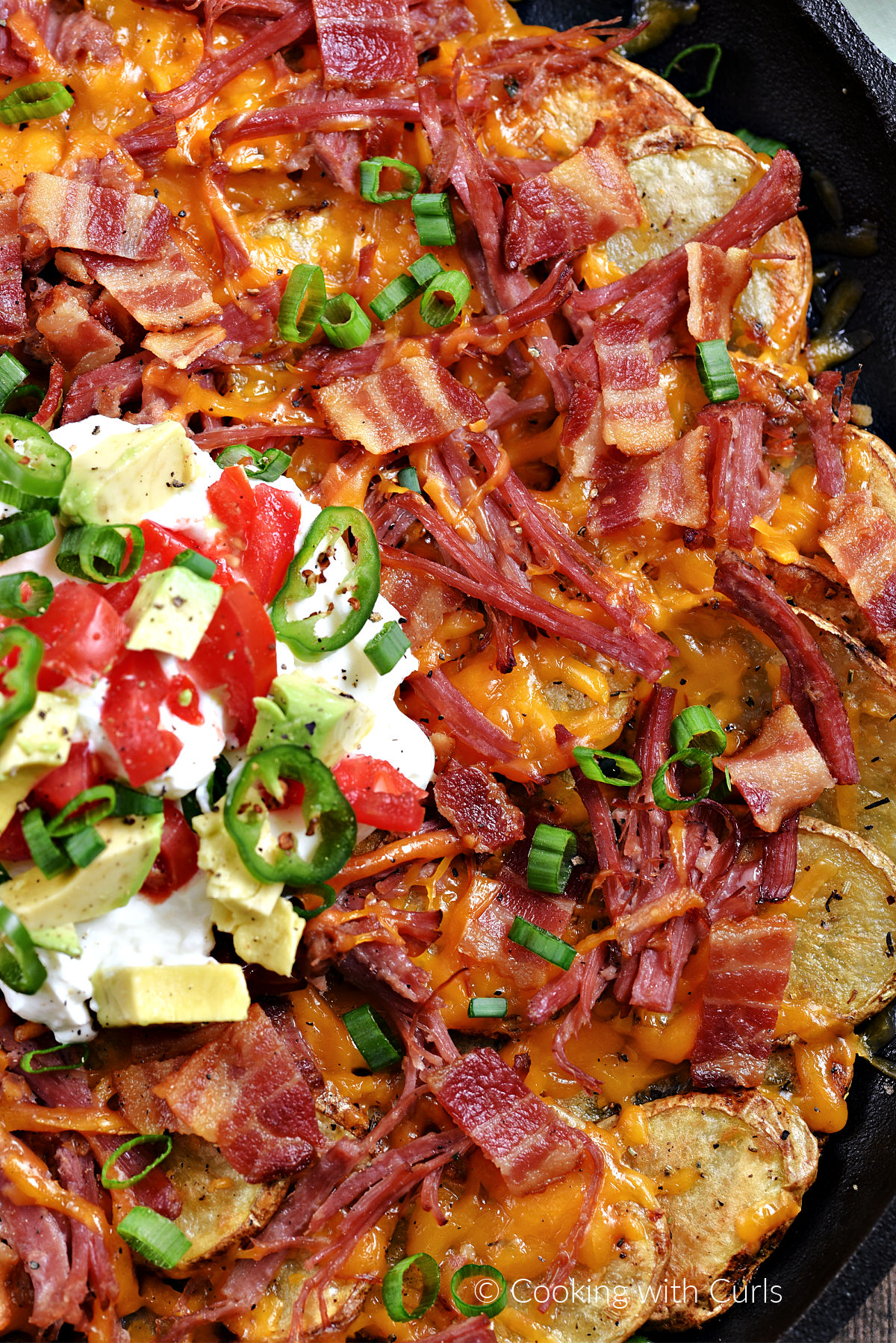 Corned Beef Irish Nachos in a cast iron skillet. 