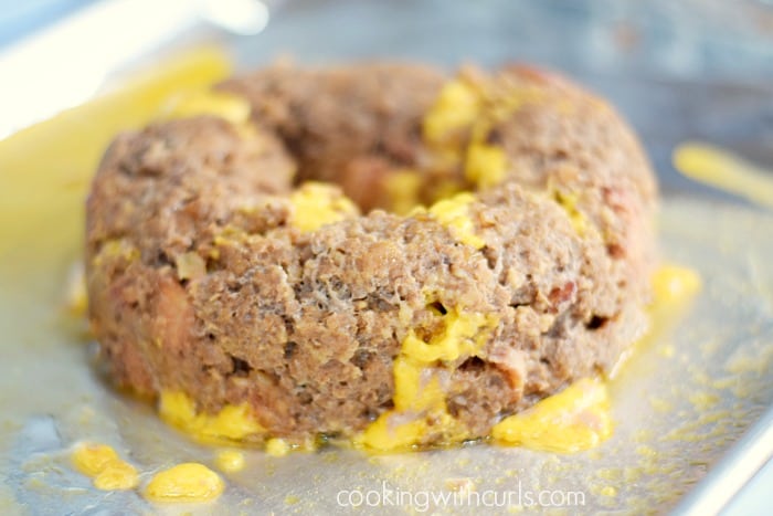 A ring shaped Bacon Cheeseburger Meatloaf on a baking sheet.