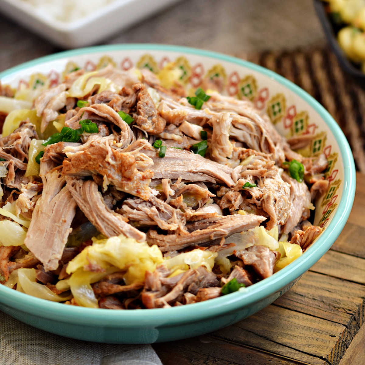 A bowl of shredded Instant Pot Kalua Pork with cabbage.