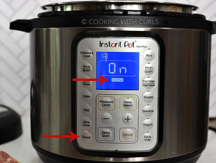 Instant Pot set to Saute - Normal with red arrows pointing to the buttons. 