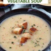 A bowl of Irish vegetable soup topped with sourdough croutons and fresh thyme with title graphic across the top.