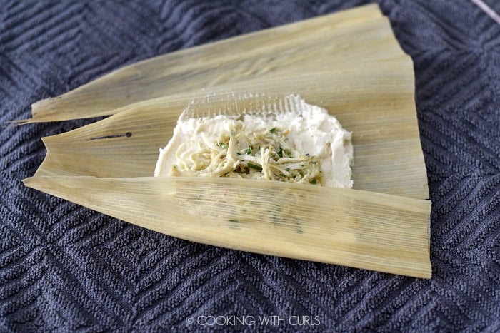 Roll the corn husk around the tamale mixture. 