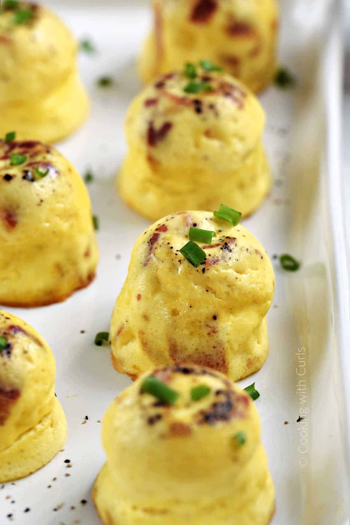 Seven-instant-pot-bacon-cheddar-egg-bites-on-a-platter.