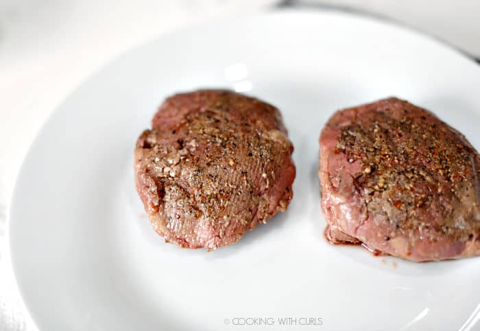 two sous vide filets on a white plate. 